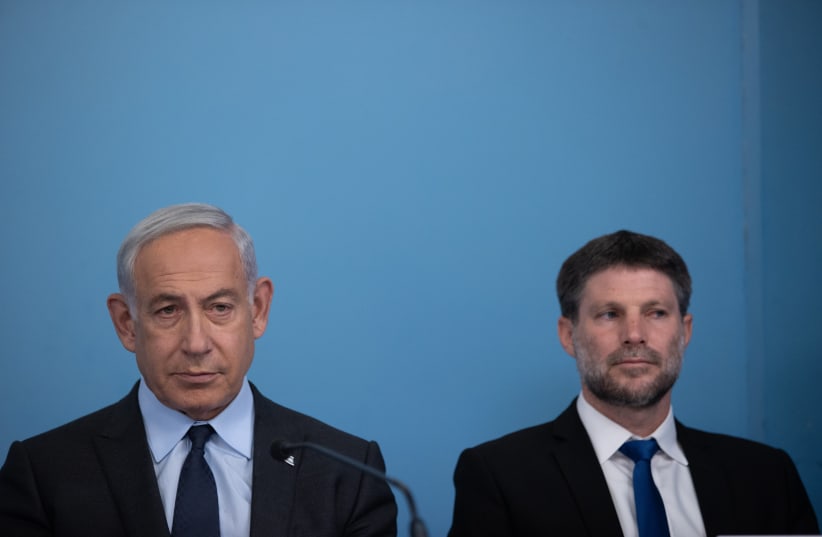 Prime minister Benjamin Netanyahu and Finance Minister Bezalel Smotrich seen during a press conference, at the Prime Minister's Office in Jerusalem. April 30, 2023 (photo credit: ALEX KOLOMOISKY/POOL)