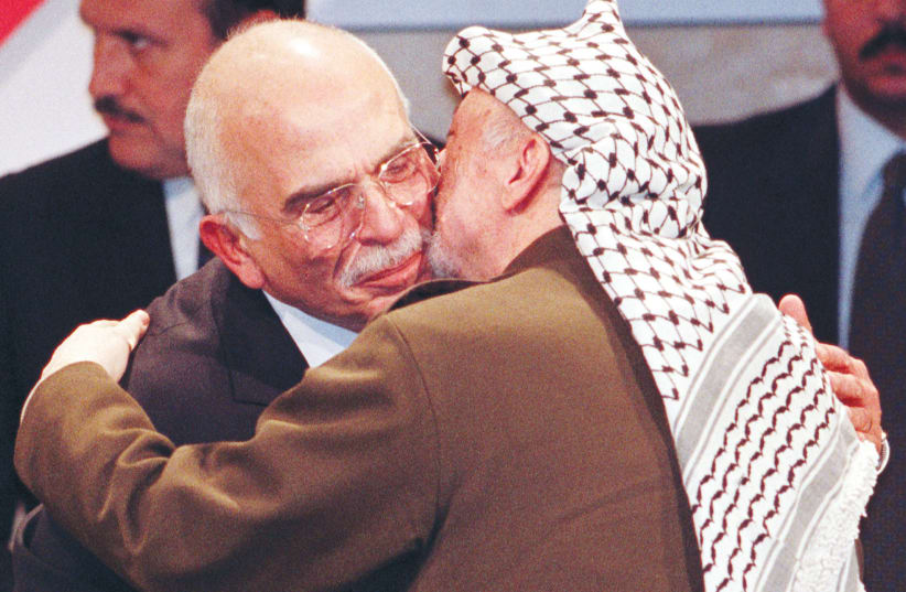  THEN-PA HEAD Yasser Arafat hugs Jordan’s King Hussein after the latter received the German Media Award, in Baden-Baden, 1997. In September 1970, the two leaders were bitter enemies.  (photo credit: REUTERS)