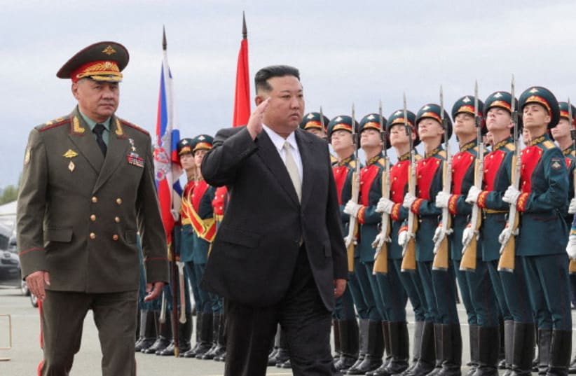  North Korea's leader Kim Jong Un and Russia's Defence Minister Sergei Shoigu inspect the guard of honour at Knevichi aerodrome near Vladivostok in the Primorsky region, Russia, September 16, 2023.  (photo credit: Russian Defence Ministry/Handout via REUTERS)