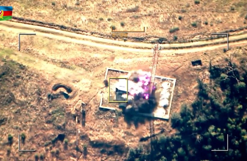  A still image from video, published by Azerbaijan's Defense Ministry, shows what it said to be an attack and neutralization of the military radio-technical node of the units of the armed forces of Armenia in the region of Nagorno-Karabakh, in this image taken from video published September 19, 2023 (photo credit: Azerbaijan's Ministry of Defense/Handout via REUTERS)