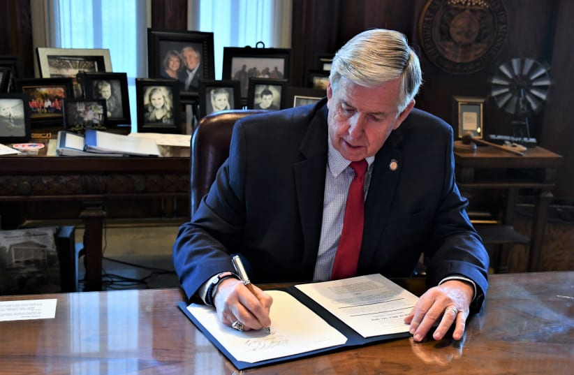  Mike Parson signing a bill. (photo credit: Wikimedia Commons)