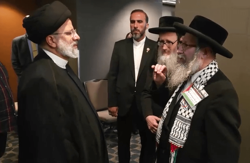 Iranian President Ebrahim Raisi (left) meets with members of the anti-Zionist Neturei Karta group on the sidelines of the UN General Assembly. September 20, 2023 (photo credit: SCREENSHOT FARS NEWS AGENCY)