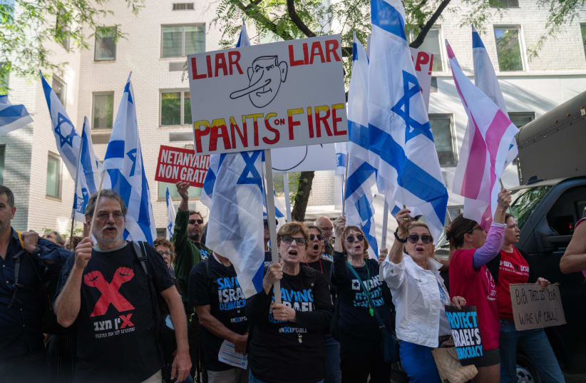  Anti-judicial reform activists protest against the judicial overhaul and and Israeli Prime Minister Benjamin Netanyahu during his visit in Manhattan, New York City, September 19, 2023. (photo credit: Luke Tress/Flash90)
