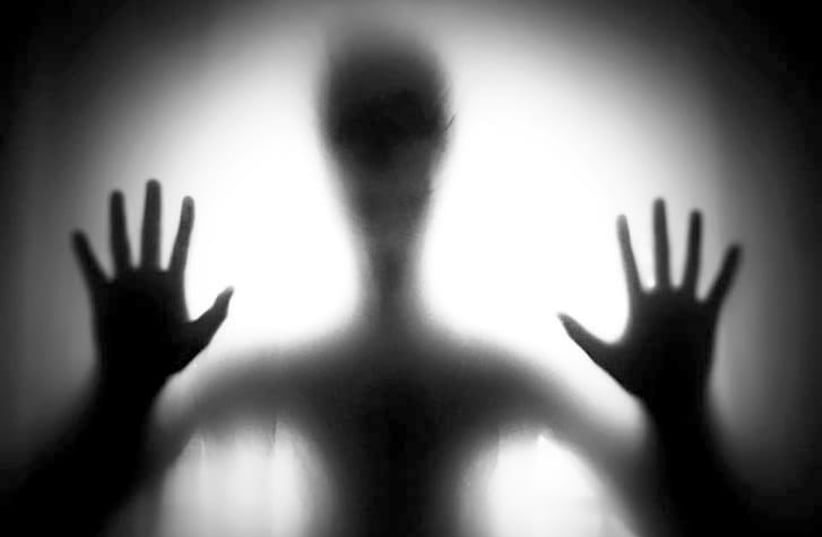 A black and white image of a ghostly being. (photo credit: PICKPIK)