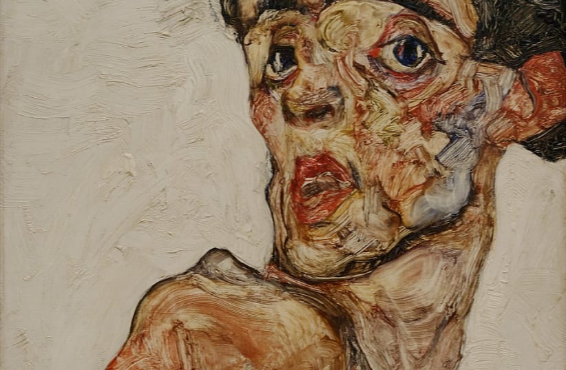 Self-portrait with raised bare shoulder, painted in 1912 by Egon Schiele. (photo credit: Wikimedia Commons)