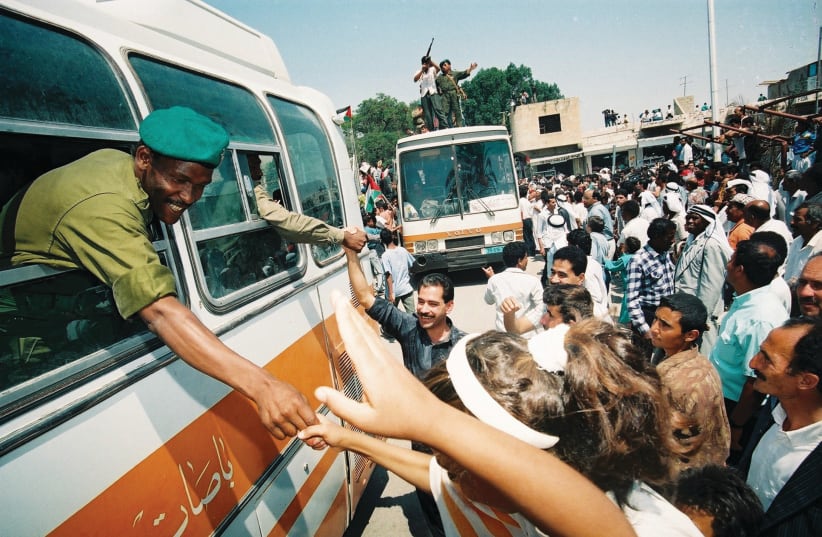 PALESTINIAN POLICE enter Jericho for the first time, welcomed by ecstatic citizens, May 1994. (photo credit: YOSSI ALONI/FLASH90)