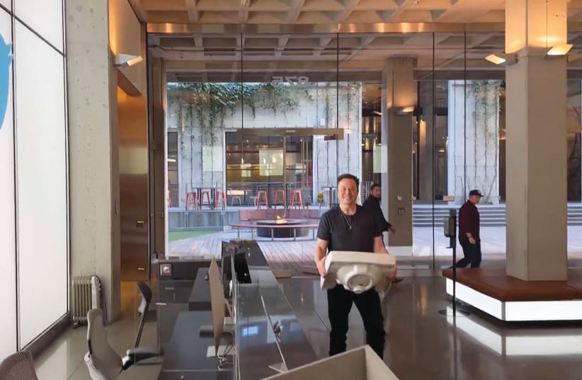  IN THIS video grab posted on his account, billionaire entrepreneur Elon Musk shows himself in Oct. 2022 carrying a sink into Twitter’s San Francisco headquarters, days before his contentious takeover of the social media giant (which he eventually renamed X). (photo credit: Twitter/AFP via Getty Images)