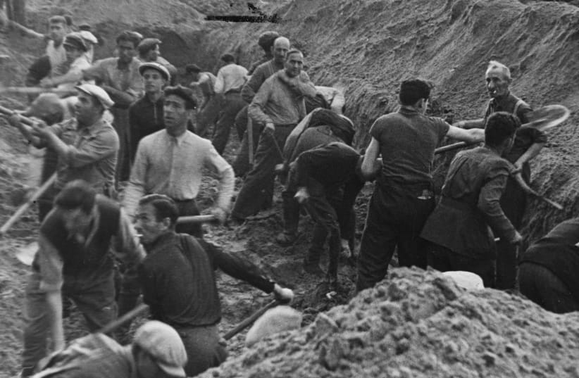  JEWS DIG a trench at the Ponary Forest killing site outside of Vilnius.  (photo credit: YAD VASHEM PHOTO ARCHIVES)