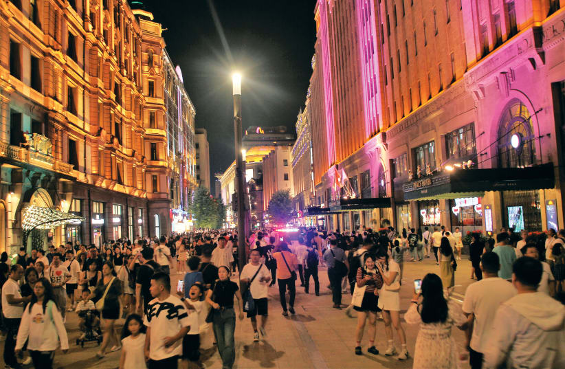  THOUSANDS OF people walk along Nanjing Street pedestrian mall in downtown Shanghai. (photo credit: ORI LEWIS)