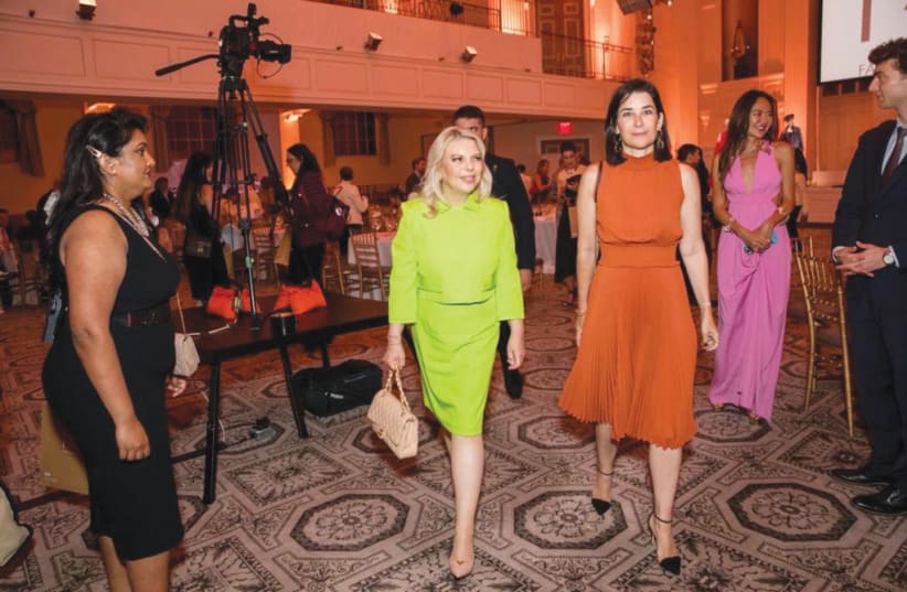  Sara Netanyahu, in the company of wives of heads of state and government, arrives at Fashion 4 Development.  (photo credit: Ohad Kav)