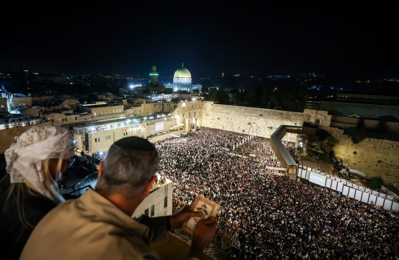 Thousands gather for Slihot prayers at the Western Wall in the Old City of Jerusalem, early on September 22, 2023, before Yom Kippur. (photo credit: Chaim Goldberg/Flash90)
