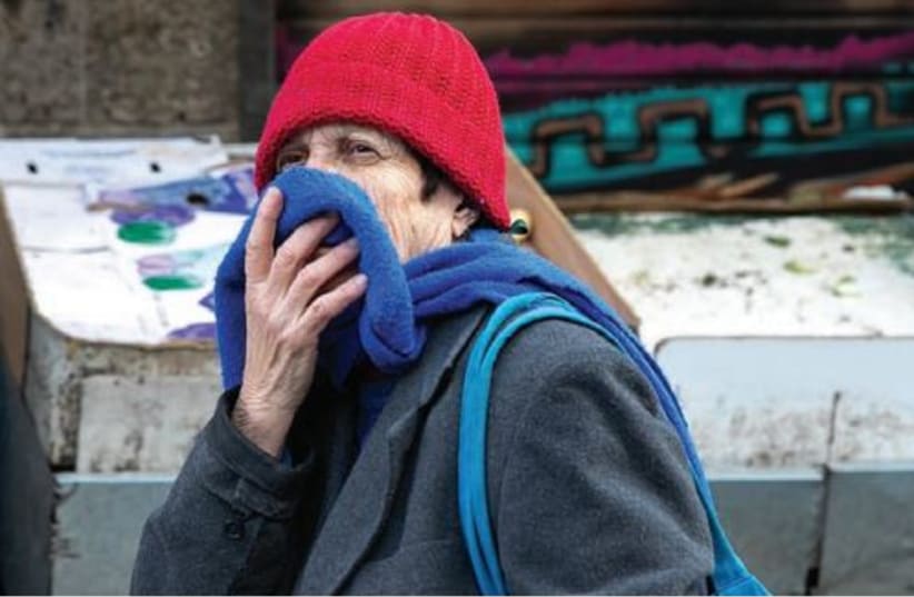  COVERING YOUR mouth with your hand or clothing when coughing or sneezing, protects other people from germs and is polite, says the writer. Illustrative photo. (photo credit: OLIVIER FITOUSSI/FLASH90)