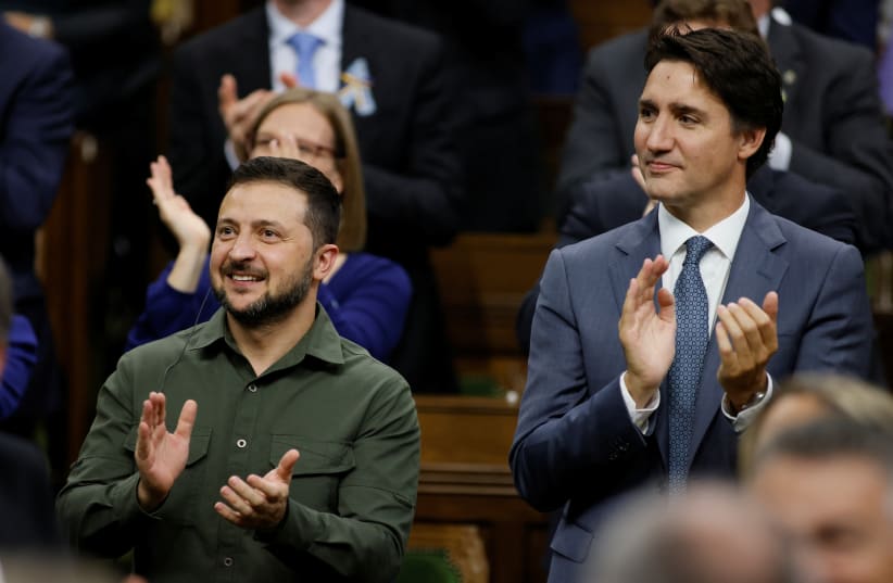  Canadian Prime Minister Justin Trudeau and Ukraine's President Volodymyr Zelenskiy react following his speech at the House of Commons on Parliament Hill in Ottawa, Ontario, Canada September 22, 2023. (photo credit: REUTERS/Blair Gable/Pool)