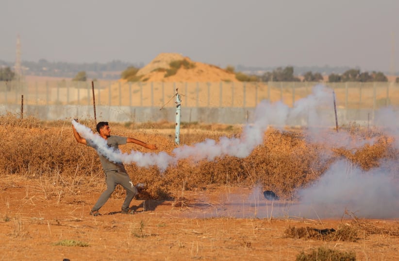  Palestinians clash with Israeli forces near the border between Israel-Gaza, in Gaza City, on September 25, 2023. (photo credit: ATIA MOHAMMED/FLASH90)