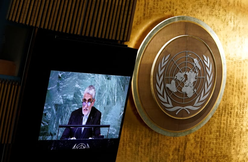  Iran’s Ambassador to the United Nations Amir Saeid Iravani is seen on a screen as he speaks to delegates before a vote on a resolution recognizing Russia must be responsible for reparation in Ukraine at the United Nations Headquarters in New York, U.S., November 14, 2022. (photo credit: REUTERS/EDUARDO MUNOZ)