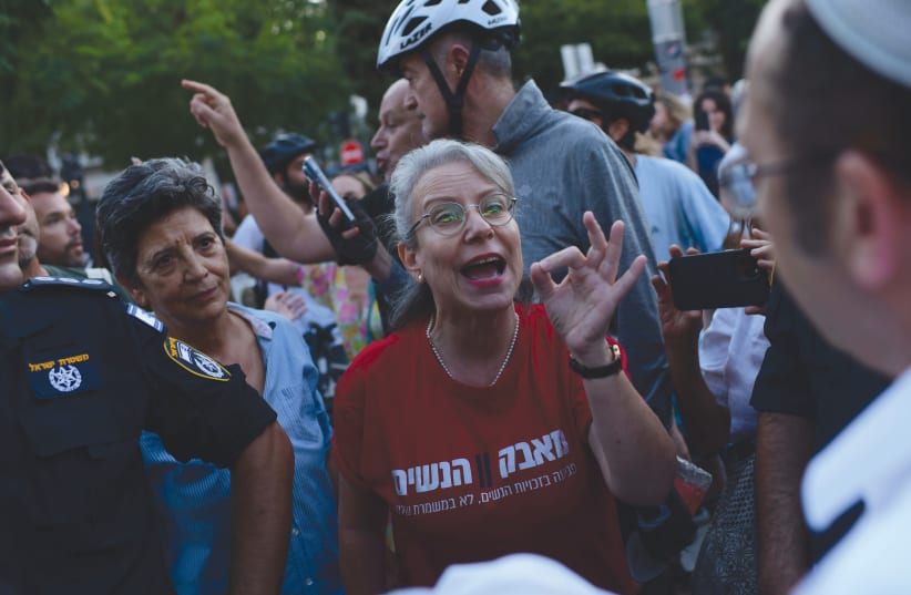  CONFRONTATIONS TAKE place at the onset of Yom Kippur on Sunday evening, at Dizengoff Square in Tel Aviv, over the issue of the placement of a partition between men and women for a High Holy Day service there.  (photo credit: TOMER NEUBERG/FLASH90)
