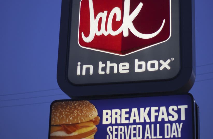  A sign is seen at a Jack in the Box fast food restaurant which serves breakfast all day in Los Angeles, California, May 11, 2012. (photo credit: REUTERS/DAVID MCNEW)