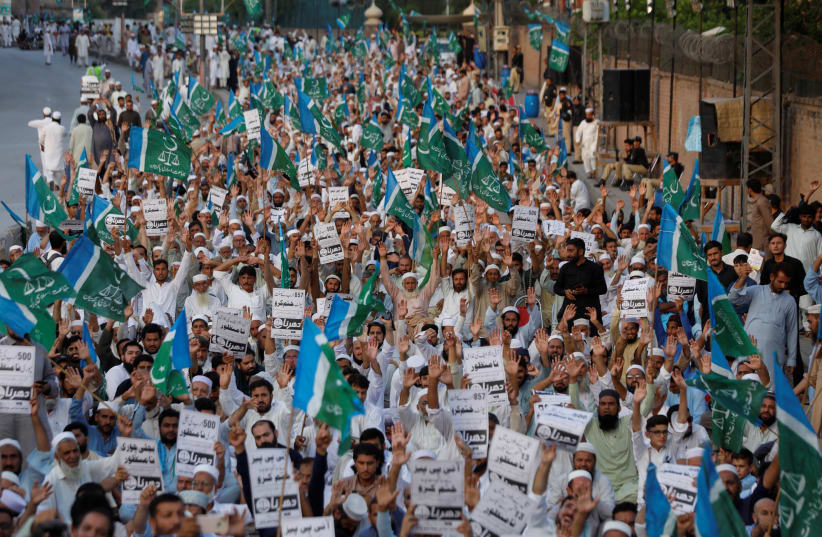  Supporters of the religious and political party Jamaat-e-Islami (JI) chant slogans against the hike on fuel prices and power billings inflation, during a protest in Peshawar, Pakistan September 18, 2023.  (photo credit: Fayaz Aziz/Reuters)