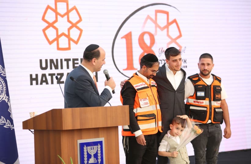 CEO Eli Pollak with volunteers and the boy they saved. (photo credit: DOVID LEFF/UNITED HATZALAH)