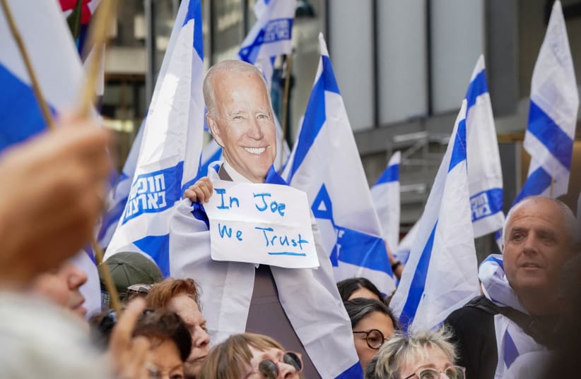  A view of a placard depicting US President Joe Biden at a demonstration by pro-democracy Israelis and Israeli Americans near the Intercontinental Hotel, where Israeli Prime Minister Benjamin Netanyahu met with Biden on the sidelines of the UN General Assembly, in New York, U.S., September 2023 (photo credit: REUTERS/BING GUAN)