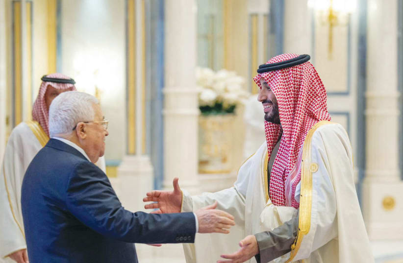  SAUDI CROWN Prince Mohammed bin Salman greets Palestinian Authority head Mahmoud Abbas during the China-Arab summit in Riyadh, last year. (photo credit: SAUDI PRESS AGENCY/REUTERS)