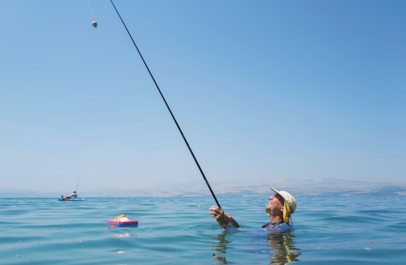  FISHING IN the Kinneret, Israel's only freshwater source. (photo credit: MICHAEL GILADI/FLASH90)