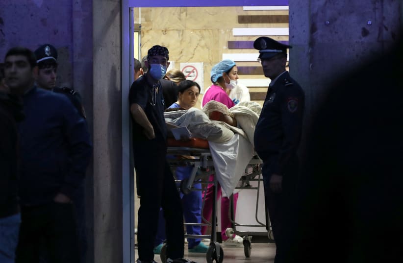  Medics assist a person injured in an explosion at a fuel depot near Stepanakert in the Nagorno-Karabakh region, at the National Burn Center in Yerevan, Armenia September 26, 2023. (photo credit: Hayk Baghdasaryan/Photolure via REUTERS)
