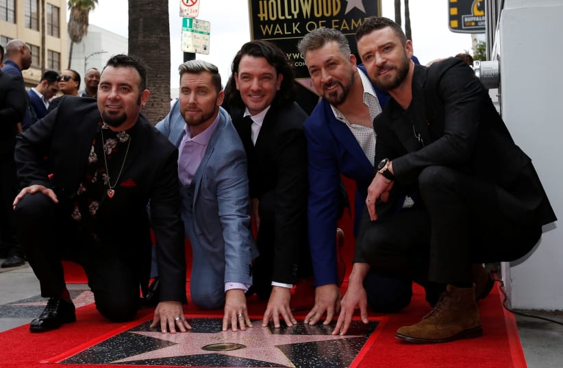  American boy band *NSYNC pose during the unveiling ceremony of their star on the Hollywood Walk of Fame in Los Angeles, U.S. April 30, 2018. (photo credit:  REUTERS/Mario Anzuoni)