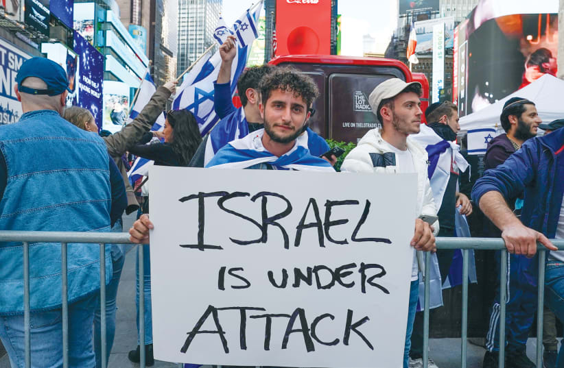  A PRO-ISRAEL rally takes place at Times Square in New York City, May 2021, during Operation Guardian of the Walls. The writer poses the question: Are Jewish Americans supportive of Israel? (photo credit: David ‘Dee’ Delgado/Reuters)