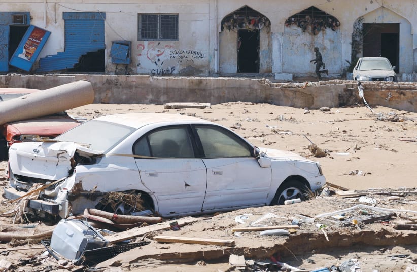  RUBBLE AND signs of destruction following floods in Derna, Libya: The chaos in the country came to a breaking point when Libya experienced historic rainfall earlier this month, the writer notes. (photo credit: Amr Alfiky/Reuters)