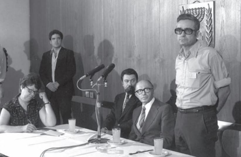  Meron Medzine, director of the Government Press Office, at a news conference with then-prime minister Menachem Begin. (photo credit: DAVID ELDAN/GPO)