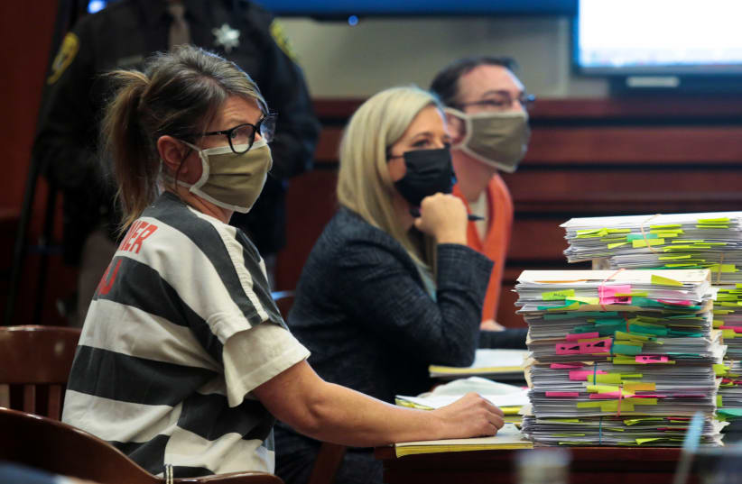  Jennifer Crumbley, parent of accused Oxford High School gunman Ethan Crumbley, listens during a court procedural hearing in Rochester Hills, Michigan, U.S., February 24, 2022. (photo credit: REUTERS/REBECCA COOK)