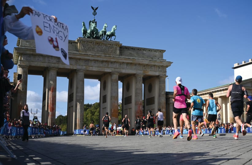  RUNNERS PASS through Brandenburg Gate during the Berlin Marathon last week. Berlin is the German city with the fastest growing Jewish population. Can one even fathom that? (photo credit: REUTERS)