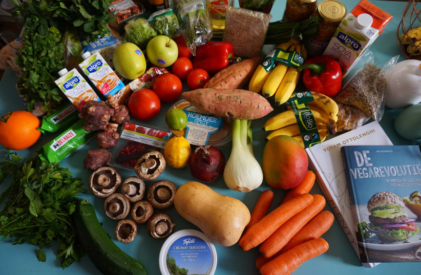  Vegan and vegetarian groceries and cook books. (photo credit: Wikimedia Commons)