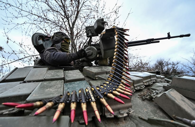  A Ukrainian serviceman checks a machine gun of a tank after loading an ammunition during a military training near a frontline, amid Russia's attack on Ukraine, in Zaporizhzhia Region, Ukraine March 29, 2023. (photo credit: REUTERS/STRINGER)