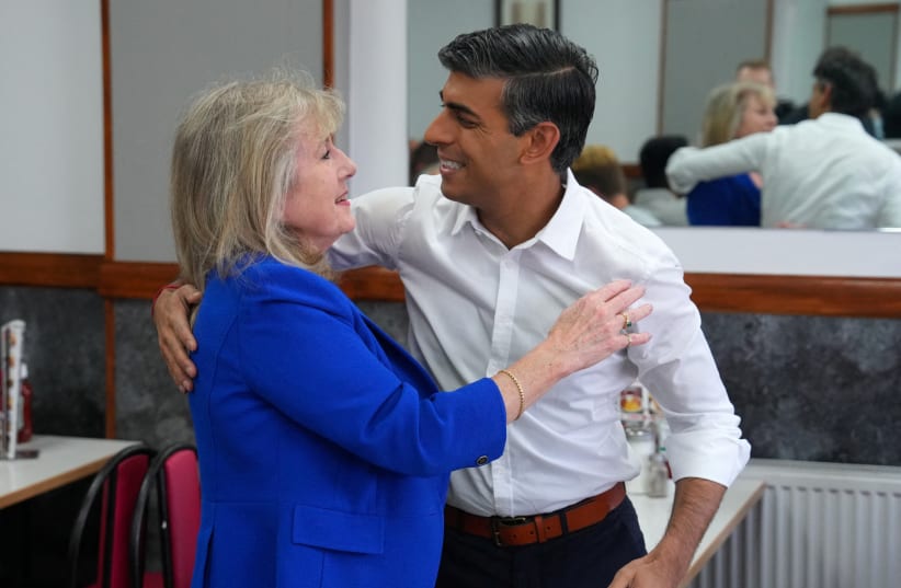  Prime Minister Rishi Sunak is greeted by London mayoral candidate Susan Hall as he visits Uxbridge to congratulate Conservative Party candidate, Steve Tuckwell, after he won the Uxbridge and South Ruislip by-election, on July 21, 2023 in Uxbridge, Britain. (photo credit: Carl Court/Pool via REUTERS)