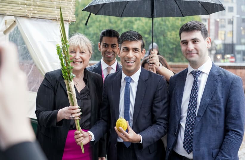  Prime Minister Rishi Sunak visiting the Board of Deputies of British Jews’ succah at the Conservative Party conference with Board of Deputies President Marie van der Zyl and Senior Vice President David Mendoza-Wolfson Tuesday, October 3rd, 2023. (photo credit: COURTESY/BOARD OF DEPUTIES OF BRITISH JEWS.)
