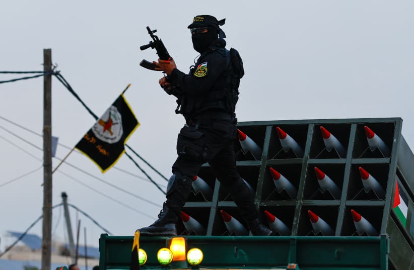  A Palestinian Islamic Jihad militant participates in an anti-Israel military parade marking the 36th anniversary of the movement's foundation in Gaza City, October 4, 2023 (photo credit: REUTERS/MOHAMMED SALEM)