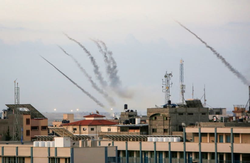  Hamas fires a large number of rockets towards Israel in the city of Rafah in the southern Gaza Strip, October 7, 2023.  (photo credit: ABED RAHIM KHATIB/FLASH90)