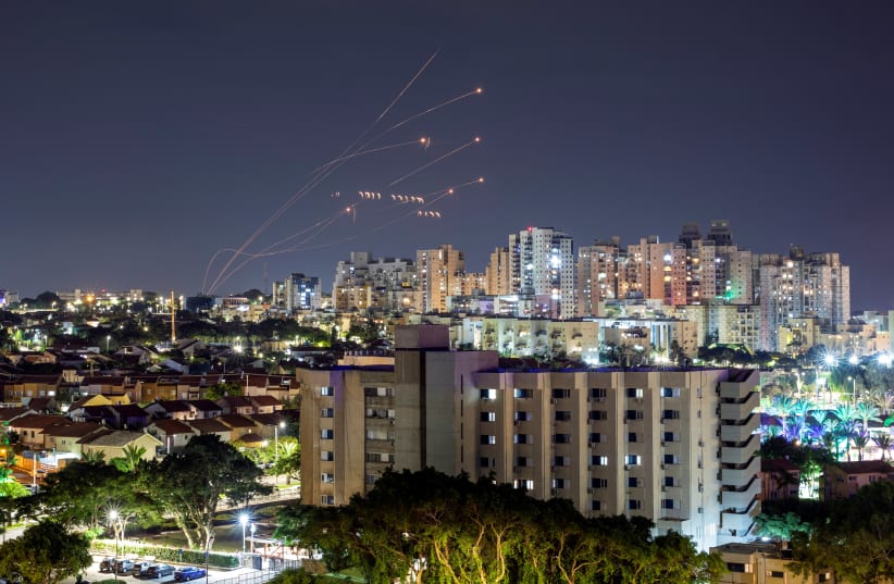  Israel's Iron Dome anti-missile system intercepts rockets launched from the Gaza Strip, as seen from Ashkelon in southern Israel October 7, 2023. (photo credit: REUTERS/AMIR COHEN)