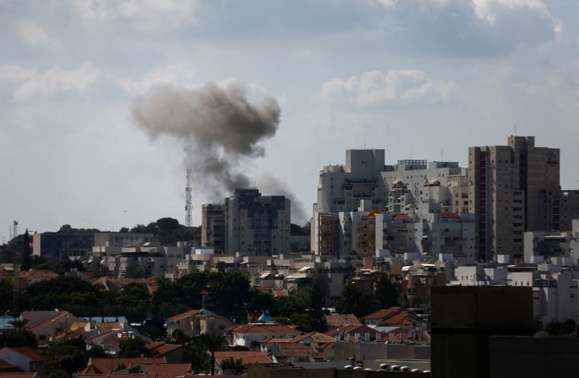  Smoke rises in the aftermath of rocket barrages that were launched from Gaza, in Ashkelon, Israel October 7, 2023.  (photo credit: REUTERS/AMIR COHEN)