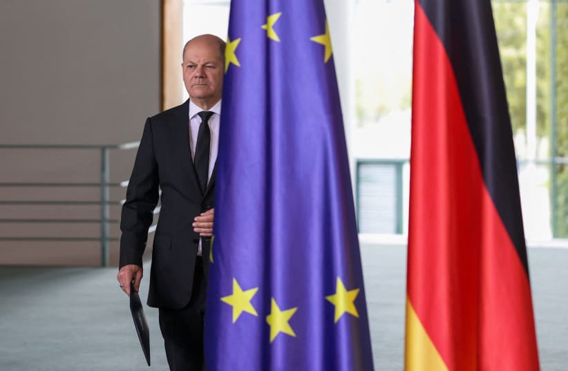  German Chancellor Olaf Scholz walks as he comments on the situation in the Middle East, one day after Hamas' attacks on Israel, in the chancellery, Berlin, Germany, October 8, 2023. (photo credit: REUTERS/Liesa Johannssen)