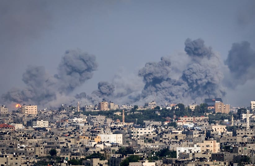 Smoke rises after Israeli air strikes near the border east of the city of Rafah in the southern Gaza Strip, October 8, 2023 (photo credit: ATIA MOHAMMED/FLASH90)