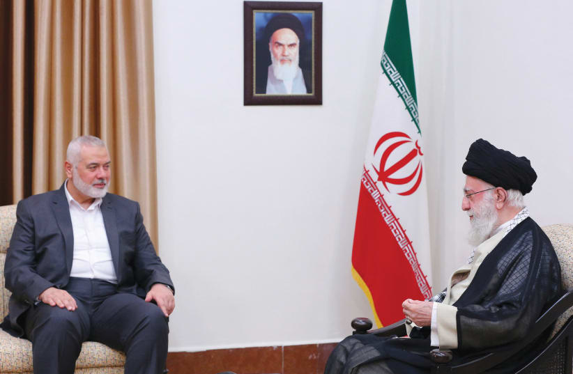  Iran's Supreme Leader Ayatollah Ali Khamenei meets with Hamas leader Ismail Haniyeh in Tehran, Iran, in June. (photo credit: Office of the Iranian Supreme Leader/West Asia News Agency/Reuters)