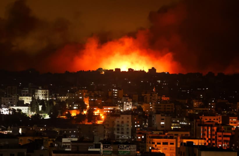  Fire and smoke rises during an Israeli airstrikes in in Gaza City, on October 8, 2023 (photo credit: ATIA MOHAMMED/FLASH90)