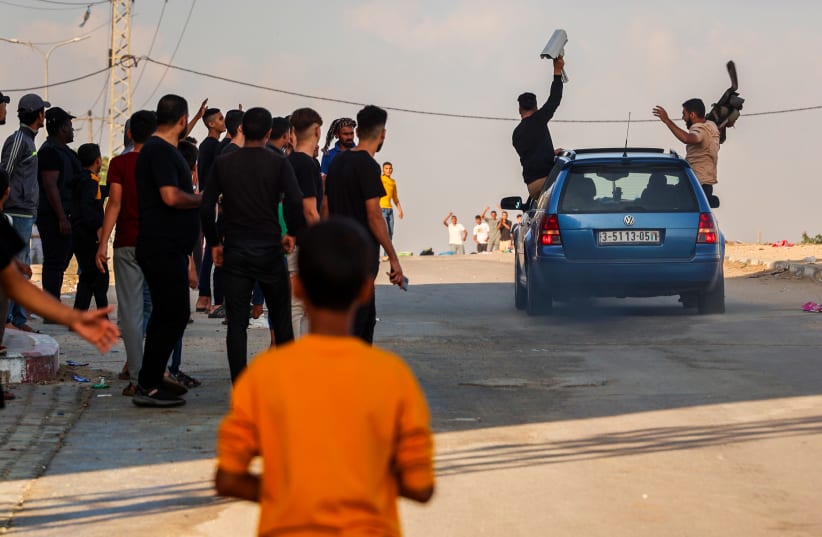  Palestinians at the Erez Crossing, also known as the Beit Hanoun Crossing, between Israel and the northern Gaza Strip, after the Hamas have launched a large attack on Israel, October 7, 2023 (photo credit: ATIA MOHAMMED/FLASH90)