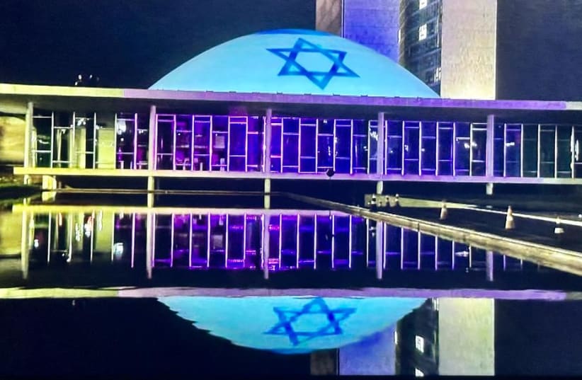  The flag of Israel was laser projected over the building of Brazil's National Congress in solidarity with the Israeli victims of Hamas (photo credit: MARCUS M. GILBAN)