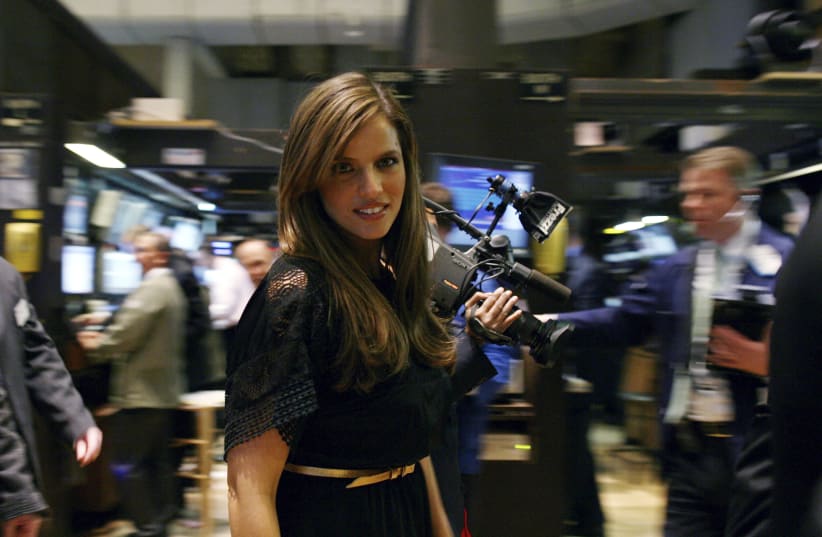  Israeli actress and producer Noa Tishby walks the floor after ringing the opening bell at the New York Stock Exchange, February 26, 2009. (photo credit: REUTERS/BRENDAN MCDERMID)