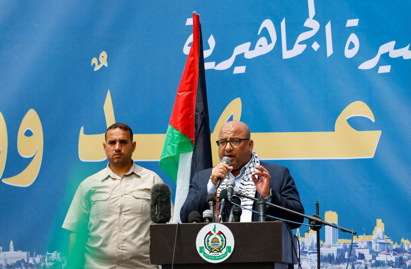  Zakaria Abu Maamar, a member of Hamas, speaks as Palestinian Hamas supporters attend a rally against visits by Israeli right wing groups to Al-Aqsa mosque, in Khan Younis in the southern Gaza Strip May 26, 2023 (photo credit: REUTERS/IBRAHEEM ABU MUSTAFA)
