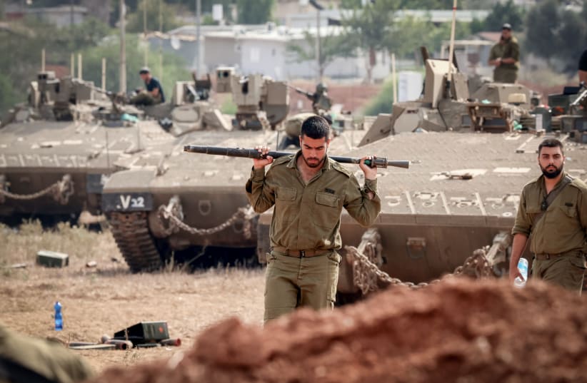  Israeli soldiers at a staging area near the Israeli-Gaza Border, southern Israel, October 10, 2023. (photo credit: YOSSI ZAMIR/FLASH90)